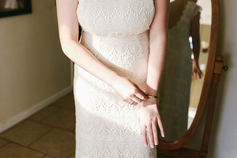 bride wearing nisolo jewelry